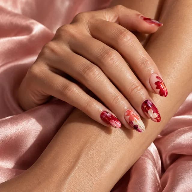 Intricate red and pink floral nail art